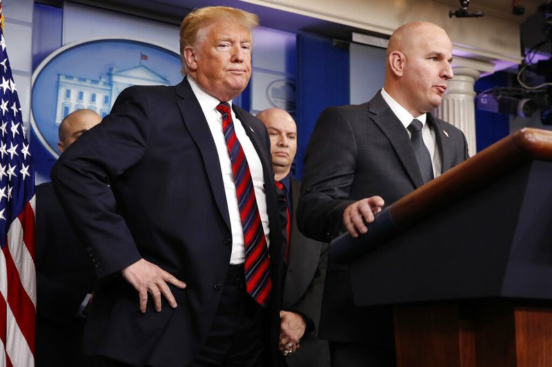 FILE - In this Jan. 3, 2019, file photo, President Donald Trump, left, listens as Brandon Judd, president of the National Border Patrol Council, talks about border security after making a surprise visit to the press briefing room of the White House in Washington. (AP Photo/Jacquelyn Martin, File)