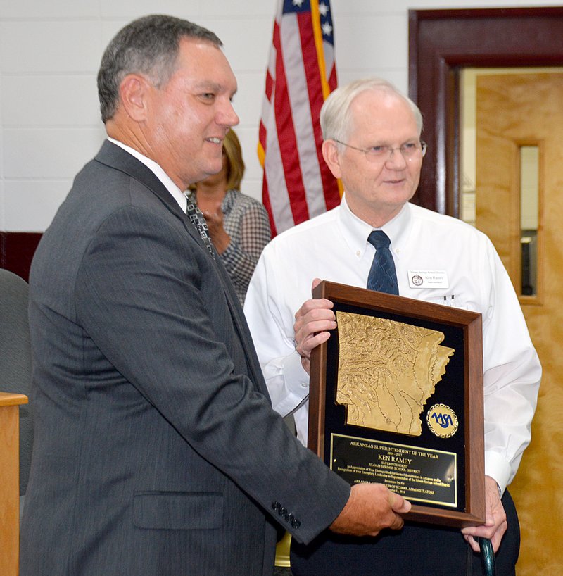 File photo/Herald-Leader
Superintendent Ken Ramey, right, accepted the 2016-2017 Arkansas Superintendent of the Year award from Richard Abernathy, executive director of the Arkansas Association of Educational Administrators in September 2016. On Thursday, Ramey announced his plans to retire from the Siloam Springs School District effective June 30 after a 52-year career in education.