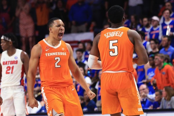 Tennessee forward Grant Williams (2) and guard Jordan Bone (0) celebrate after guard Admiral Schofield (5) made a 3-point shot against Florida in the final minute of an NCAA college basketball game Saturday, Jan. 12, 2019, in Gainesville, Fla. (AP Photo/Matt Stamey)