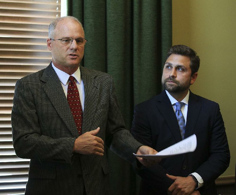 Sen. Jim Hendren, R-Sulphur Springs, Senate President Pro Tempore-elect, talks Thursday along with Sen. Jonathan Dismang, R-Searcy, right, Senate President Pro Tempore, during a press conference about the proposed ethics rules for the Senate. 