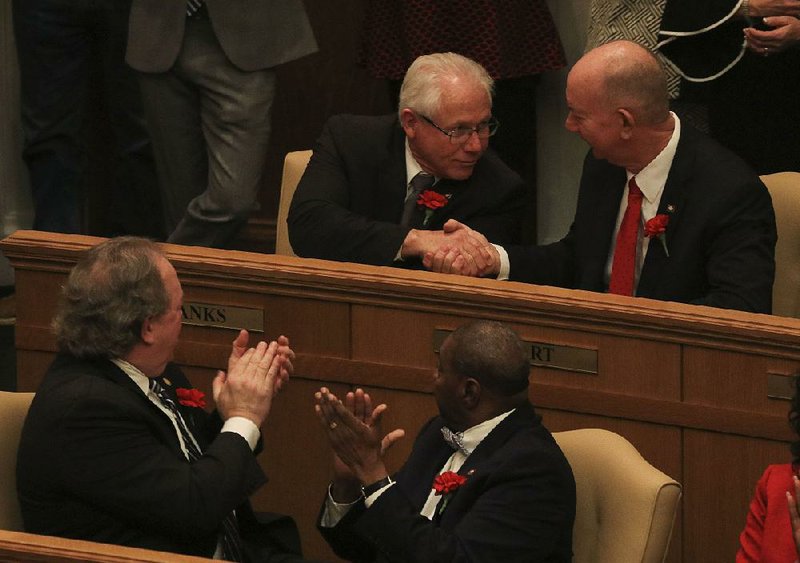 Rep. Bruce Cozart (top right), R-Hot Springs, congratulates Rep. Jon Eubanks (top left), R-Paris, on Monday after Eubanks was named Speaker Pro-tempore of the House during the first day of the legislative session. Cozart was named chairman of the House Education committee.