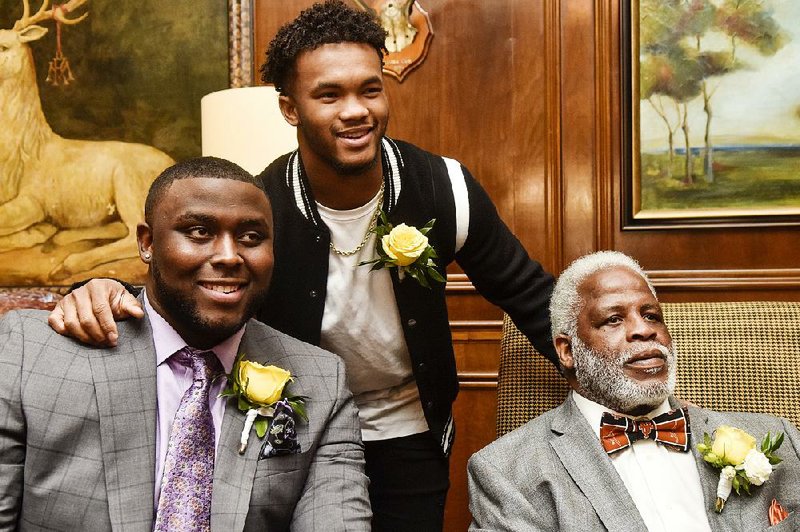 University of Mississippi offensive lineman Greg Little, left, University of Oklahoma quarterback Kyler Murray and Earl Campbell gather together during the Earl Campbell Tyler Rose Award at the Willow Brook Country Club in Tyler, Texas, on Wednesday, Jan. 9, 2019. Six exceptional college athletes were selected as finalists for this year's award.