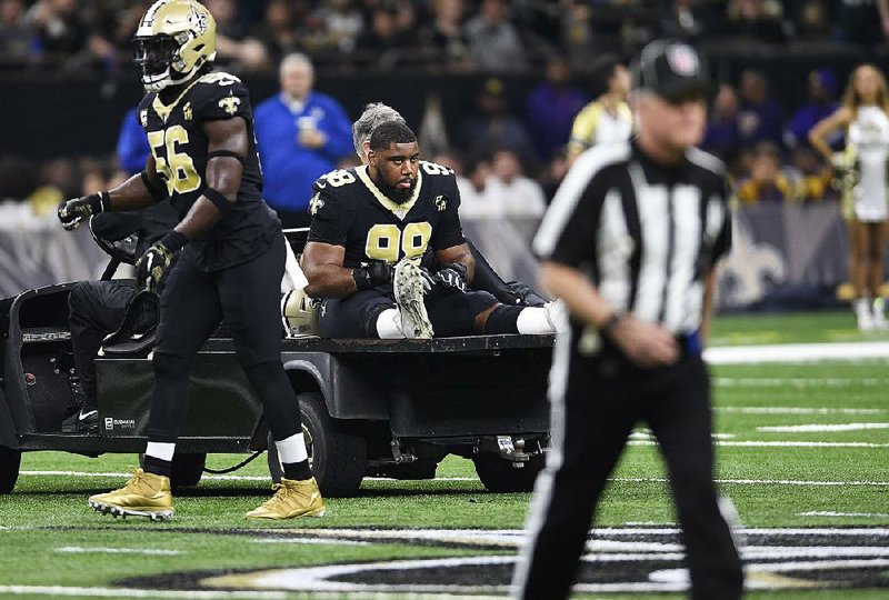 New Orleans Saints defensive tackle Sheldon Rankins leaves the field after an injury against the Philadelphia Eagles on Sunday in New Orleans.