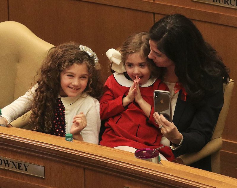 Rep. Nicole Clowney, D-Fayetteville, is shown with her daughters Evie (left), 8, and Kit, 4, at the state Capitol in this file photo.