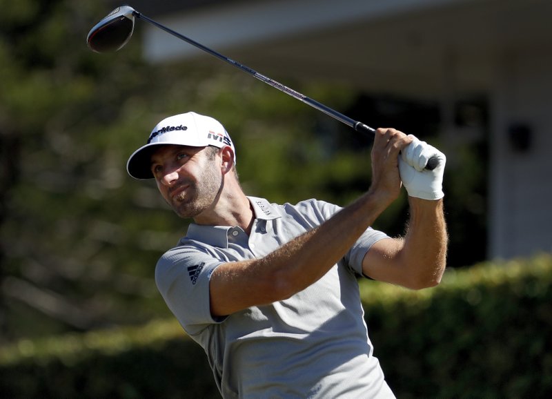 FILE - In this Jan. 6, 2019, file photo, defending champion Dustin Johnson plays his shot from the first tee during the final round of the Tournament of Champions golf event at Kapalua Plantation Course in Kapalua, Hawaii. Johnson is among top players scheduled for a new golf tournament in Saudi Arabia at the end of January. (AP Photo/Matt York, File)