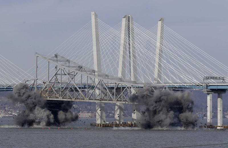A section of the old Tappan Zee Bridge is brought down with explosives in this view from Tarrytown, N.Y., Tuesday, Jan. 15, 2019. (AP Photo/Seth Wenig)

