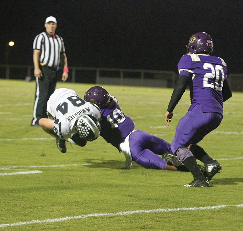 Terrance Armstard/News-Times Junction City's Dhante Gibson (10) brings down Bearden's Garrett McWhorter (84) as teammate Jvacye Cook (20) closes in during their clash this past season. On Tuesday, Gibson announced he was committing to play football at Ouachita Baptist.