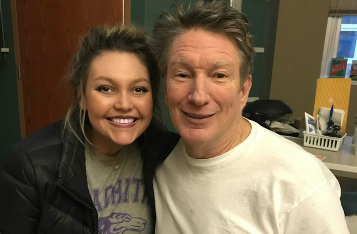 University of Arkansas at Little Rock nursing student Megan Crawley takes a photo with Charles Rainey Sunday as the 67-year-old recovers in the hospital after collapsing at a local gym. Photo courtesy of UALR
