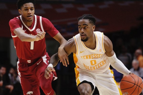 Tennessee guard Jordan Bone (0) brings the ball down the court against Arkansas guard Isaiah Joe (1) in the second half of an NCAA college basketball game, Tuesday, Jan. 15, 2019, in Knoxville, Tenn. (AP Photo/Shawn Millsaps)