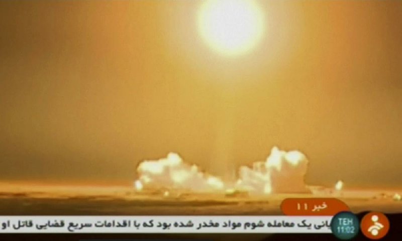 A rocket carrying the Payam satellite is launched at Iran’s Imam Khomeini Space Center in Semnan province on Tuesday in this image from Iranian state TV. 
