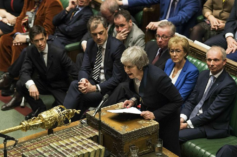 Prime Minister Theresa May speaks in the House of Commons after her plan to withdraw from the European Union was rejected. She gave little indication of what her new proposal would be. 