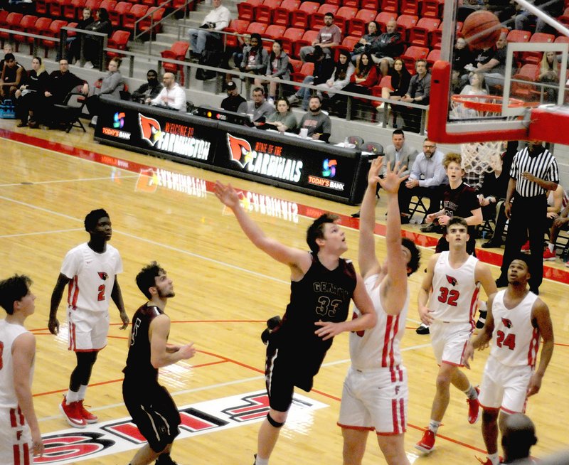 MARK HUMPHREY ENTERPRISE-LEADER/Gentry senior Dylan Kilgore, all of 6-3, has to use his athleticism to score a shot over Farmington's 6-7 senior center Austin Shelley. Despite Kilgore's success on this play the Pioneers were routed 62-22 on Tuesday, Jan. 8 at Cardinal Arena.