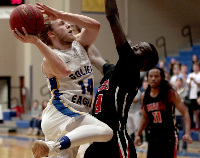 Photo courtesy of John Brown University Siloam Springs senior Jake Caudle takes a shot in the second half Saturday against Mid-America Christian. Caudle scored 19 points but the Evangels defeated the Golden Eagles 71-66.