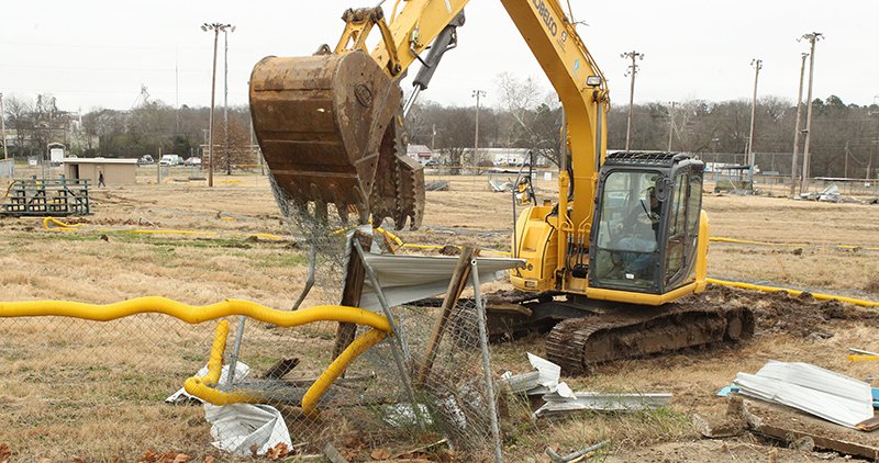 The Sentinel-Record/Richard Rasmussen PREP WORK: An Ervan Slaight Demolition and Excavation employee tears down fencing and dugouts with a backhoe Tuesday at the future site of the Majestic Park Baseball Complex, located at the former site of the Boys &amp; Girls Club of Hot Springs. The site preparation is fully funded by a grant from the Oaklawn Foundation.