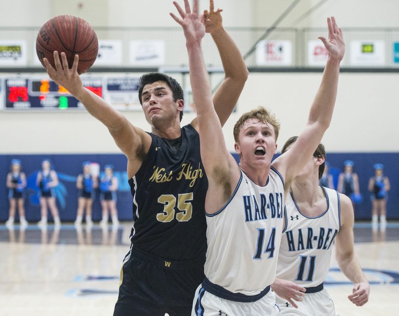 NWA Democrat-Gazette/BEN GOFF @NWABENGOFF Austin Conner (35) of Bentonville West and Cole Bishop of Springdale Har-Ber reach for a rebound Tuesday, Jan. 15, 2019, at Wildcat Arena in Springdale.