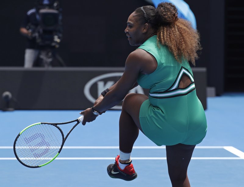 United States' Serena Williams reacts after hitting a backhand return during her first round match against Germany's Tatjana Maria at the Australian Open tennis championships in Melbourne, Australia, Tuesday, Jan. 15, 2019. (AP Photo/Kin Cheung)