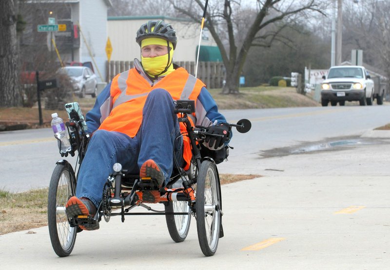 NWA Democrat-Gazette/DAVID GOTTSCHALK Jason McCrory rides Tuesday on the Powell Street Section of the Razorback Greenway in Springdale. McCrory started in Centerton and was heading to Fayetteville for lunch and then returning to Centerton on the recumbent tricycle. Representatives of Toole Design gave a presentation of their draft report for a transportation system that includes pedestrians, cyclists and motorists.