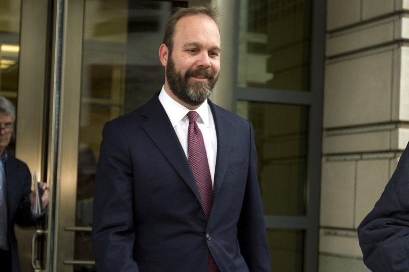 In this Feb. 23, 2018 file photo, Rick Gates leaves federal court in Washington. 