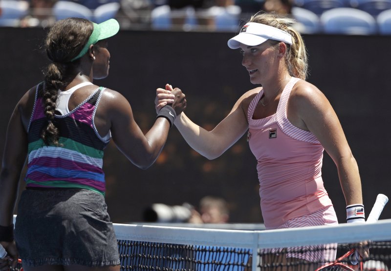 United States' Sloane Stephens, left, is congratulated by Hungary's Timea Babos after winning their second round match at the Australian Open tennis championships in Melbourne, Australia, Wednesday, Jan. 16, 2019. (AP Photo/Mark Schiefelbein)