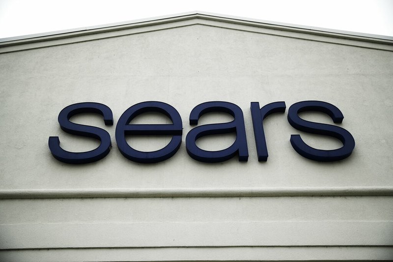 FILE - This Oct. 15, 2018 file photo shows a sign for a Sears Outlet department store is displayed in Norristown, Pa. Multiple media outlets reported early Wednesday, Jan. 16, 2019, that billionaire Eddie Lampert has won a bankruptcy auction after strengthening his bid in several days of negotiations with creditors. Lampert, Sears' chairman and largest shareholder, upped his offer to more than $5 billion and added a $120 million cash deposit through an affiliate of his ESL hedge fund. (AP Photo/Matt Rourke, File)