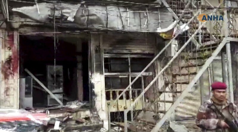 This frame grab from video provided by Hawar News, ANHA, the news agency for the semi-autonomous Kurdish areas in Syria, shows a damaged restaurant where an explosion occurred, in Manbij, Syria, Wednesday, Jan. 16, 2019. The Britain-based Syrian Observatory for Human Rights, a Syrian war monitoring group, and a local town council said Wednesday that the explosion took place near a patrol of the U.S.-led coalition and that there are casualties. (ANHA via AP)