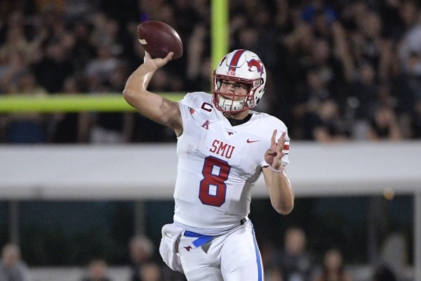 SMU quarterback Ben Hicks (8) throws a pass in front of Central Florida linebacker Gabriel Luyanda (24) and defensive lineman Anthony Montalvo (94) during the second half of an NCAA college football game Saturday, Oct. 6, 2018, in Orlando, Fla. UCF won 48-20. (AP Photo/Phelan M. Ebenhack)