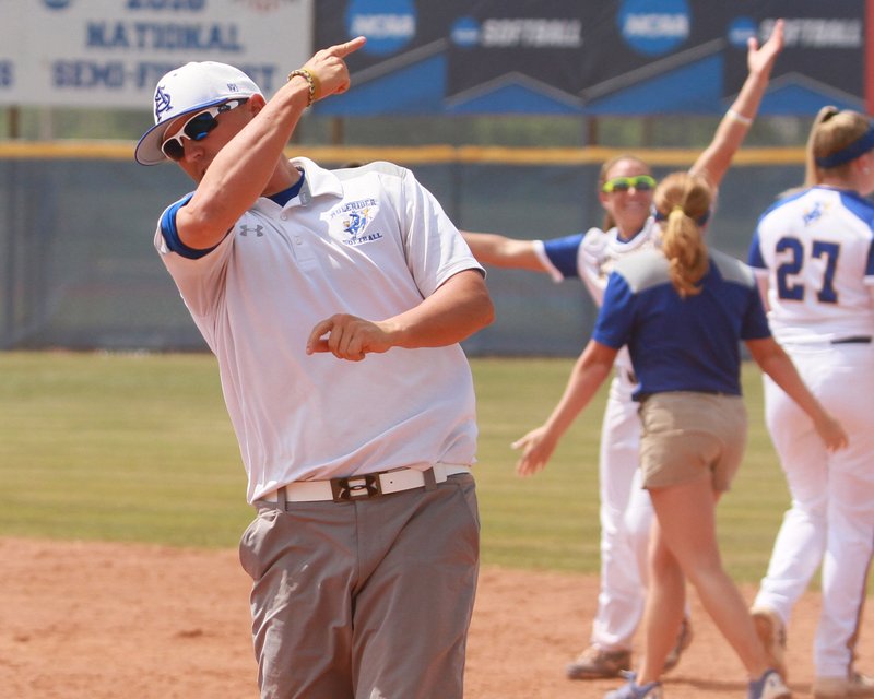 SAU head softball coach Jason Anderson celebrates following an NCAA Division II region tournament softball victory last season. The Lady Muleriders have again been tagged to win the Great American Conference.