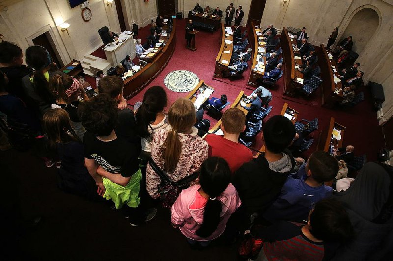 Students from Harding Academy in Searcy watch from the state Senate gallery Wednesday as Sen. Joyce Elliott, D-Little Rock, addresses colleagues during the day’s session. The Senate and the House had a full day of activity. 