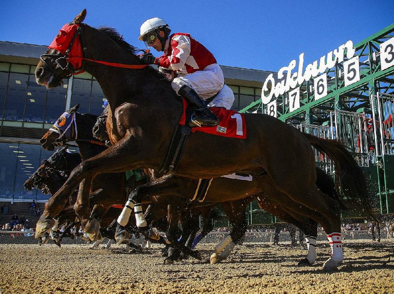 In this file photo horses burst out of the gate at Oaklawn Park in Hot Springs.