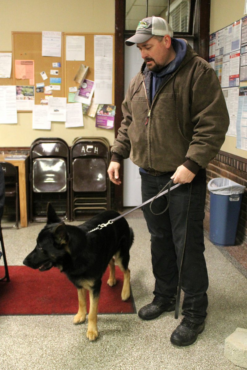 MEGAN DAVIS/MCDONALD COUNTY PRESS Anderson Police Department's newest addition, Samson, is shown with his handler, Officer David Willet, at the city council meeting Tuesday. Willet and Samson are starting their second week of training in narcotics detection and tracking.