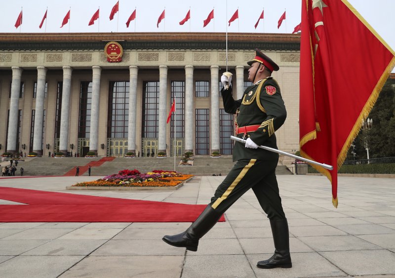 In this Nov. 9, 2017, file photo, a member of the Chinese military marches before the welcoming ceremony for President Donald Trump and Chinese President Xi Jinping at the Great Hall of the People, in Beijing, China. (AP Photo/Andrew Harnik, File)