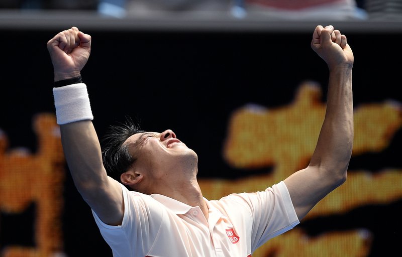 Japan's Kei Nishikori celebrates after defeating Croatia's Ivo Karlovic during their second round match at the Australian Open tennis championships in Melbourne, Australia, Thursday, Jan. 17, 2019. (AP Photo/Andy Brownbill)