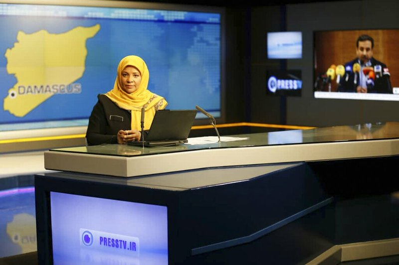 This undated photo provided by Iranian state television's English-language service, Press TV, shows American-born news anchor Marzieh Hashemi at studio in Tehran, Iran. The elder son of Hashemi says his mother is being held in the United States, but has not been charged with anything. Hussein Hashemi says she was detained Sunday, Jan. 13, 2019, as she was leaving St. Louis for Denver. He says she had filmed a Black Lives Matter documentary in St. Louis after visiting family in New Orleans. (Press TV via AP)