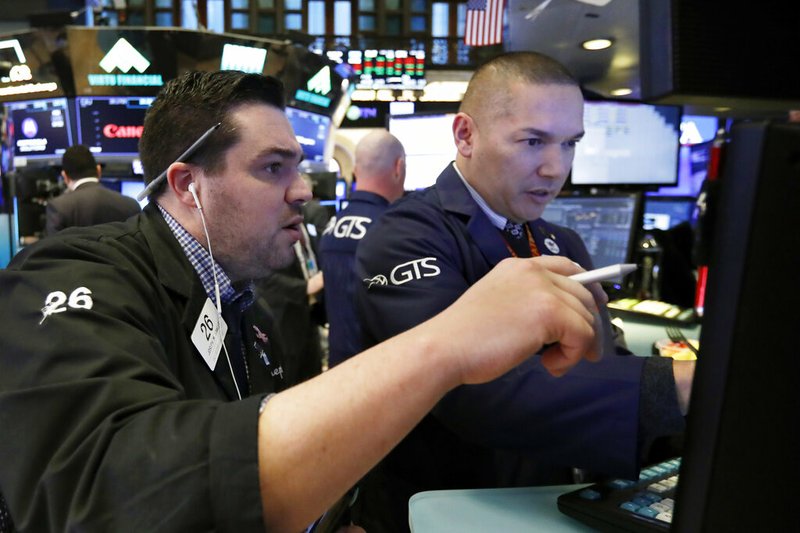 In this Jan. 11, 2019, file photo, trader Joseph Lawler, left, and specialist Mark Otto work on the floor of the New York Stock Exchange. The U.S. stock market opens at 9:30 a.m. EST on Thursday, Jan. 17. (AP Photo/Richard Drew, File)