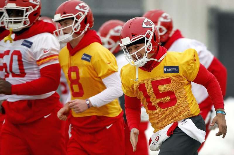 Kansas City Chiefs quarterback Patrick Mahomes (15) runs with teammates during a workout Thursday in Kansas City, Mo. The Chiefs host the New England Patriots on Sunday, seeking their first conference championship since the 1969-70 season.