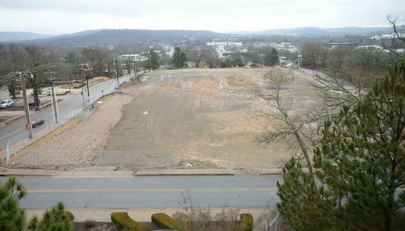 NWA Democrat-Gazette/ANDY SHUPE The site of the former City Hospital building south of the Fayetteville Public Library. The land is the site of a planned expansion of the library.