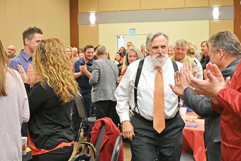 Bill McKee makes his way through the crowd as he is introduced as the Citizen of the Year at the Benton Area Chamber of Commerce’s annual awards luncheon on Jan. 10.