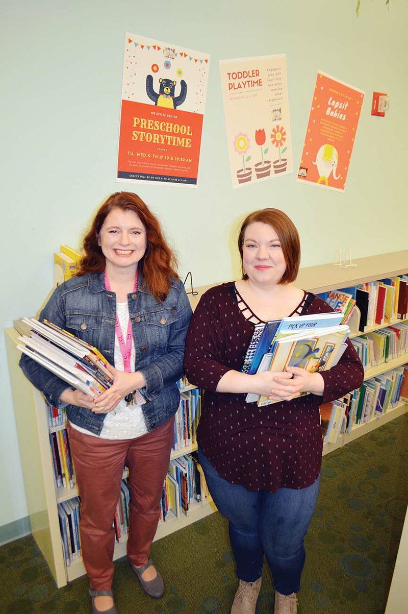 Mary Spears Polk, left, story-time programmer for the Faulkner County Library in Conway, and Dana Bayless, assistant librarian for the Vilonia branch, hold children’s books at the Conway library. The Vilonia branch will kick off the 1,000 Books Before Kindergarten program at 10:30 a.m. Jan. 30. The Faulkner County Library has 190 children enrolled in the program, which it joined in September 2018.