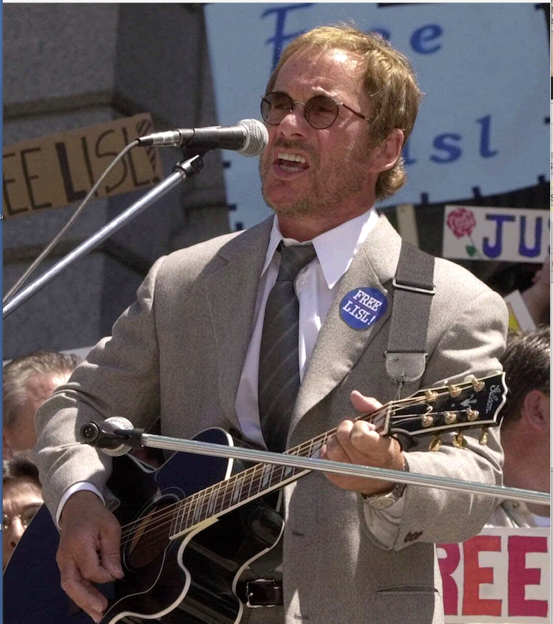 Musician Warren Zevon performs on the steps of the Colorado State Capitol in Denver, Colo., on May 14, 2001. 