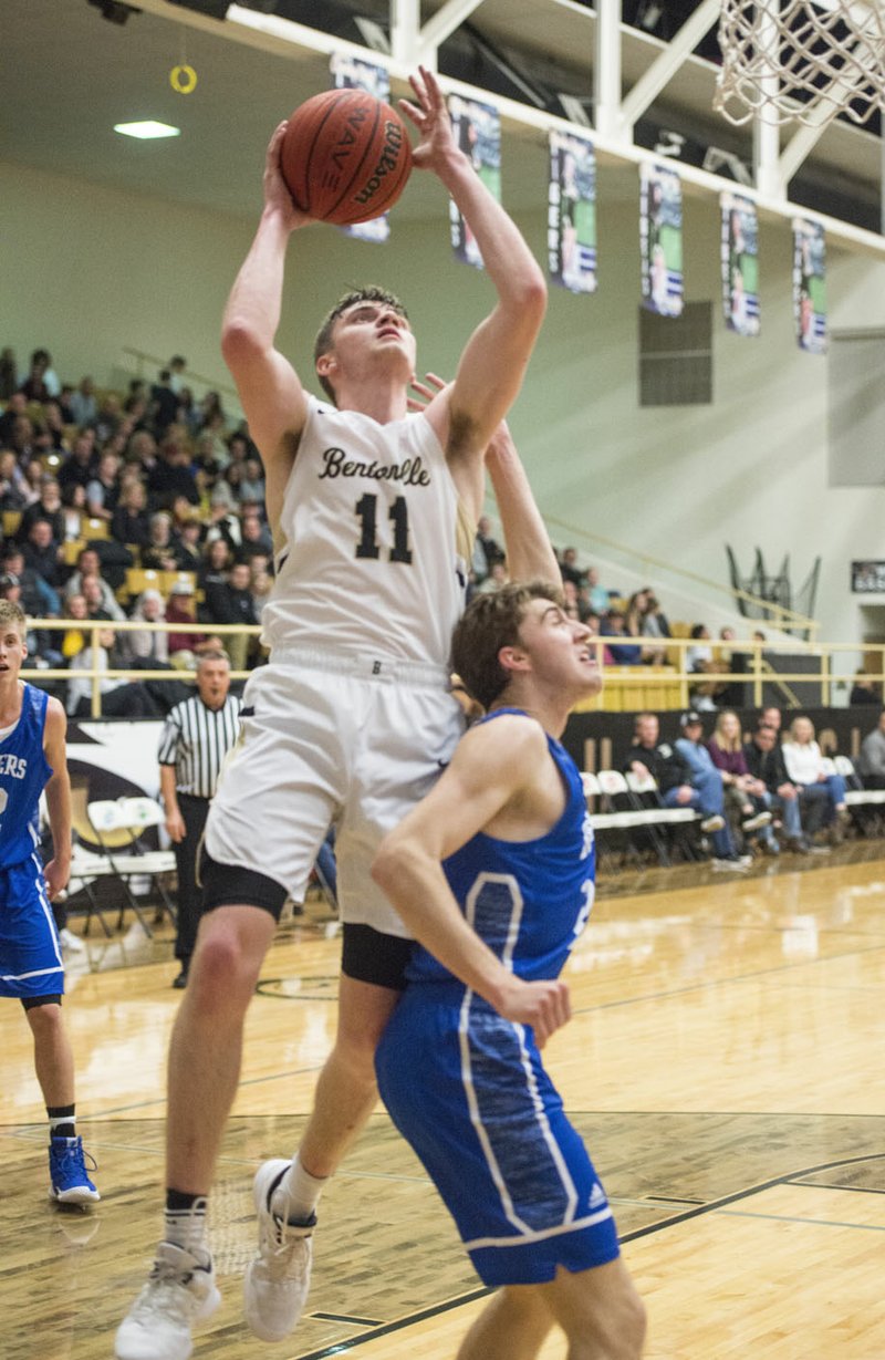 NWA Democrat-Gazette/BEN GOFF @NWABENGOFF Michael Shanks (11) of Bentonville makes a shot over Joseph Park of Rogers Friday, Jan. 18, 2019, at Bentonville's Tiger Arena.