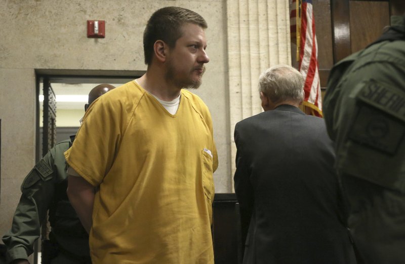 The Associated Press COURTROOM ESCORT: Former Chicago police Officer Jason Van Dyke is escorted into the courtroom for his sentencing hearing at the Leighton Criminal Court Building, Friday, in Chicago, for the 2014 shooting of Laquan McDonald.