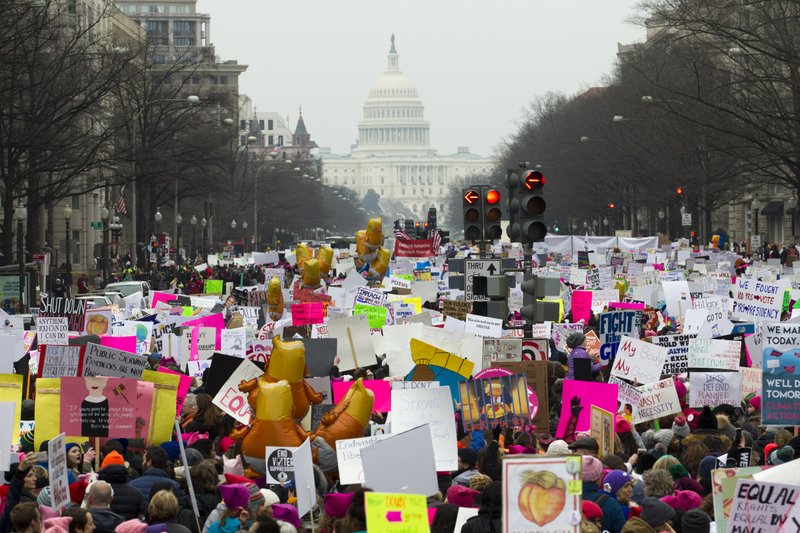 Demonstrators march on Pennsylvania Av. during the Women's March in Washington on Saturday. (AP Photo/Jose Luis Magana)

