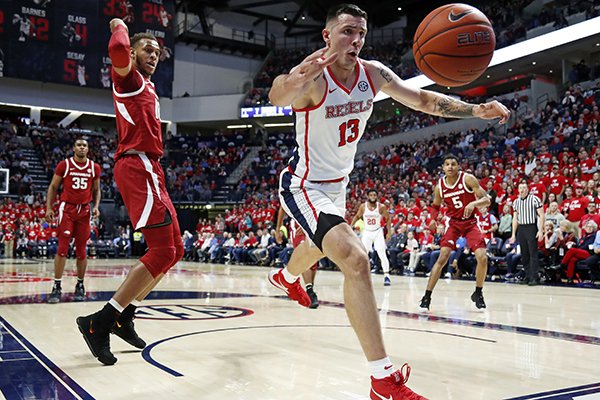 Mississippi center Dominik Olejniczak (13) chases a loose ball during the first half of the NCAA college basketball game against Arkansas in Oxford, Miss., Saturday, Jan. 19, 2019. (AP Photo/Rogelio V. Solis)

