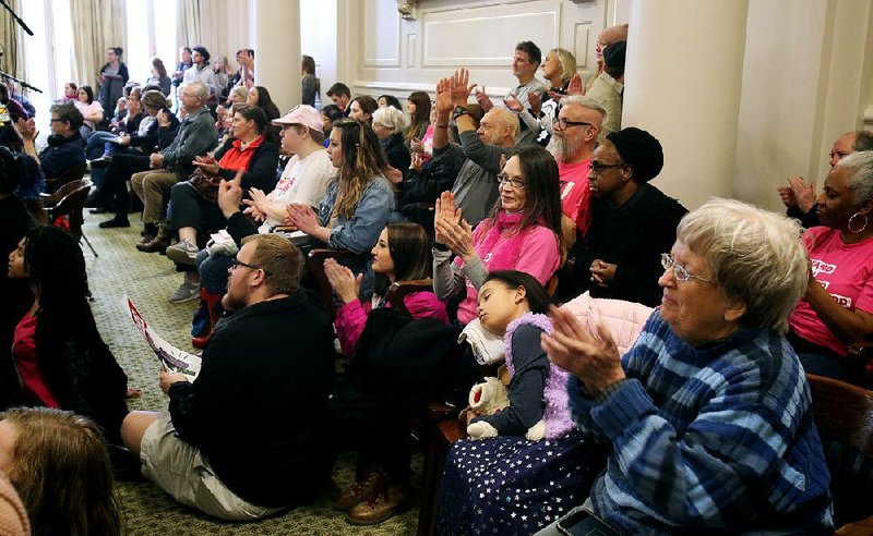 People applaud a speaker Saturday during the ninth annual Rally for Reproductive Justice held in  the Old Supreme Court Room at the state Capitol in Little Rock.