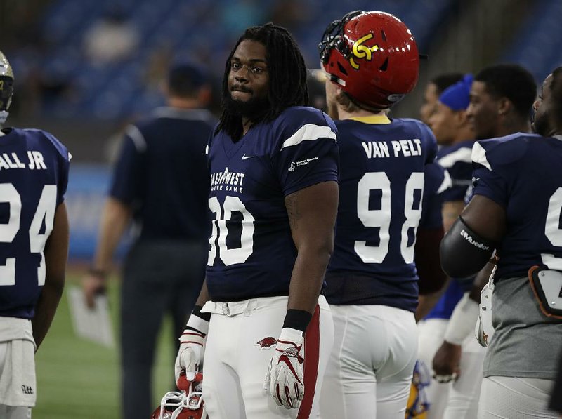 Former University of Arkansas defensive lineman Armon Watts, who played for the West team, looks on during the first half of the East-West Shrine game Saturday in St. Petersburg, Fla.