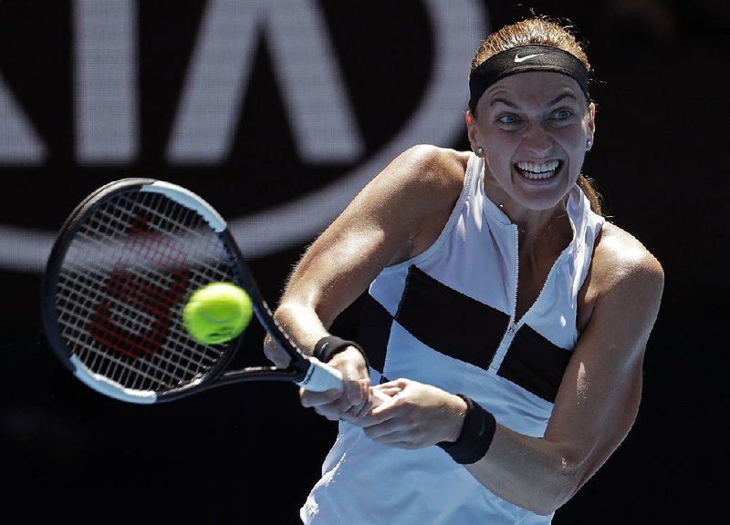 Petra Kvitova of the Czech Republic makes a backhand return while defeating Amanda Anisimova of the United States 6-2, 6-1 during their fourth-round match at the Australian Open.