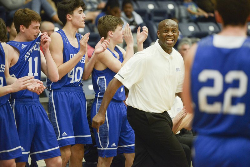 NWA Democrat-Gazette/CHARLIE KAIJO Rogers High School head boys basketball coach Lamont Frazier has his Mounties off to their best start in several years. The snapped a 28-game conference losing streak with a win over Van Buren to begin 6A-West league play.
