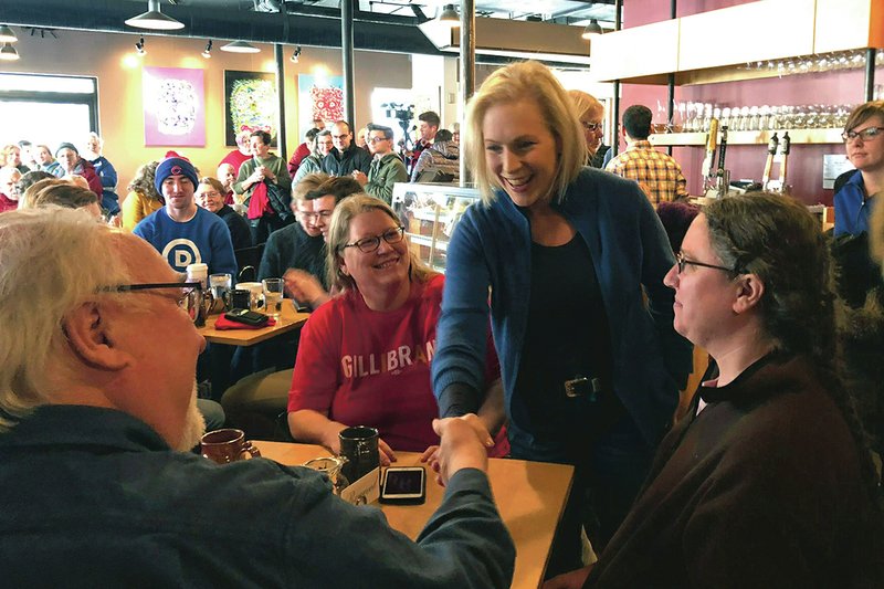 The Associated Press STOMPING GROUNDS: Sen. Kirsten Gillibrand, D-N.Y., greets patrons at Stomping Grounds Cafe in Ames, Iowa, on Saturday. Gillibrand continued her first trip to the leadoff caucus state since announcing the formation of an exploratory committee to seek the 2020 Democratic presidential nomination.