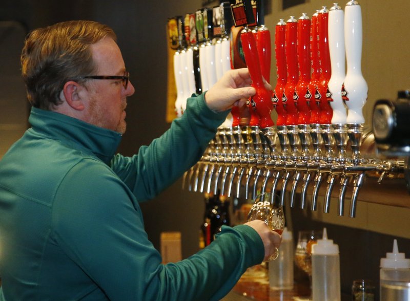 The Associated Press CHILLED BEER: Sean Mossman, director of sales and marketing for COOP Ale Works, draws a beer in the COOP taproom in Oklahoma City, Friday. Rules that went into effect in Oklahoma in October allow grocery, convenience and retail liquor stores to sell chilled beer with an alcohol content of up to 8.99 percent. Previously, grocery and convenience stores could offer only 3.2 percent beer. Liquor stores, where stronger beers were available, were prohibited from selling it cold.