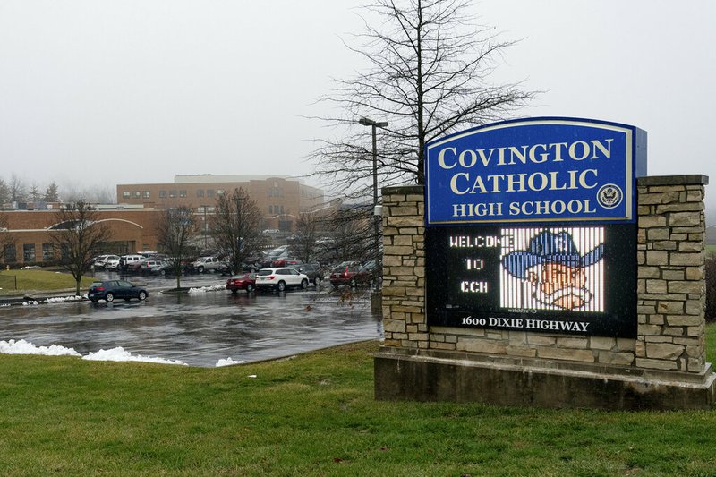 Fog covers Covington Catholic High School in Park Hills, Kentucky, Saturday, Jan 19, 2019. A diocese in Kentucky apologized Saturday after videos emerged showing students from the Catholic boys' high school mocking Native Americans outside the Lincoln Memorial on Friday after a rally in Washington. 